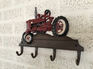 Farmhouse design coat rack with Farsnall agricultural tractor.